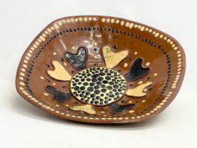 A large late 19th century continental Slipware terracotta bowl. 43x43x9cm