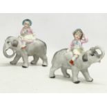 A pair of late 19th century German bisque figures on elephants. 12x12cm
