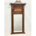 An early 19th century inlaid mahogany framed pier mirror. 1810-1820. 52x105cm