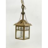 A vintage Arts & Crafts style brass porch light. 54cm including chain.