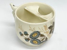 A late 19th century German moustache cup