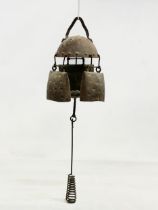 A 19th century cow bell wind chime. 55cm