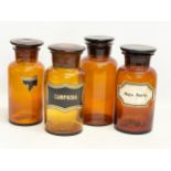4 large early 20th century apothecary chemist Amber Glass jars. Height 23cm