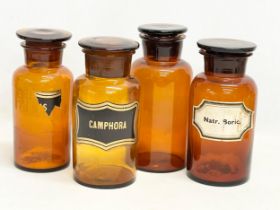 4 large early 20th century apothecary chemist Amber Glass jars. Height 23cm