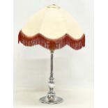 A 1930’s Art Deco chrome table lamp with shade. Base measures 32cm without shade.