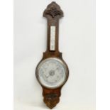 A late Victorian oak Aneroid barometer. 82cm