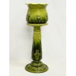 A large late 19th century Bretby Majolica Art Nouveau jardiniere on stand. 31x85cm