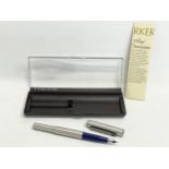 2 Parker Pens in cases.