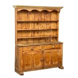 A large Victorian pine kitchen dresser. 149x40x192cm