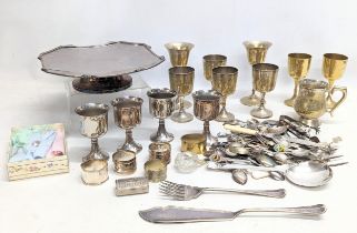 A quantity of silver plate, including cutlery, drinking goblets, napkin rings, etc.