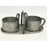 A vintage Norwegian pewter cream and sugar bowl on stand by Skurdal. Tray 20x11x9cm