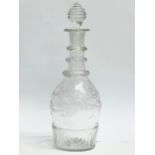 An Irish Regency period small etched crystal decanters and stopper. Circa 1800-1810. 21cm