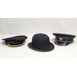 2 vintage caps, including an RUC and naval cap, with a vintage bowler hat.