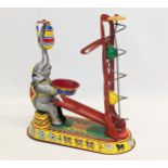 A vintage tinplate clockwork circus elephant, in working order. Made in US Zone, Germany. 21.5x24.