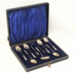 A set of ornate silver apostle spoons, Birmingham.