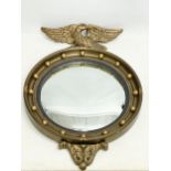 A vintage Regency style gilt framed convex mirror. 48x71cm