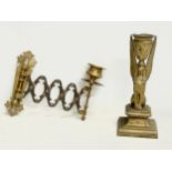 A late 19th century wall mounted candleholder and a late 19th century Egyptian Revival brass