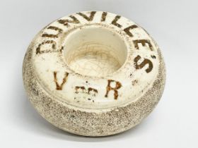 A late 19th century Dunville’s Whiskey VR match striker/holder. J.A. Campbell Royal Avenue