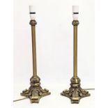 A pair of ornate gilt table lamps. 53.5cm