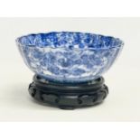 A 19th century Japanese blue and white porcelain bowl on stand. Bowl measures 16x6.5cm