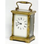 An early 20th century French brass carriage clock. Circa 1900. 8x6x15cm including handle.