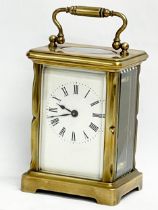 An early 20th century French brass carriage clock. Circa 1900. 8x6x15cm including handle.