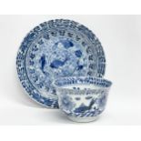 A 19th century Chinese porcelain tea bowl and saucer. Kangxi mark.