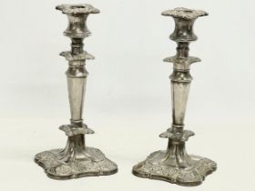 A pair of early 20th century ornate silver plated candlesticks. 25cm