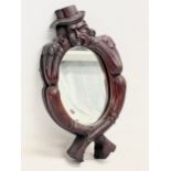 A rare 19th century Welsh Witches Mirror. Carved Folk Art frame with original scumble paint.