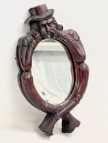 A rare 19th century Welsh Witches Mirror. Carved Folk Art frame with original scumble paint.