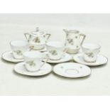 An early 20th century fine porcelain coffee set. Saucers measure 9.5cm