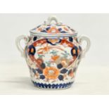 An early 19th century English Imari pattern pottery 2 handled jar with lid. 17.5x16cm