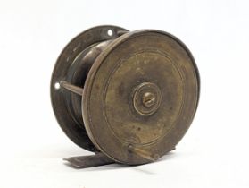 A late 19th / early 20th century brass fishing reel. 6.5x6.5cm