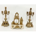 A late 19th century French brass and onyx clock set. Clock measures 25x10x31cm. Candelabras 38.5cm.