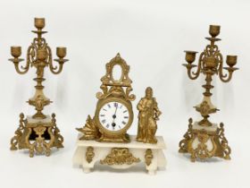 A late 19th century French brass and onyx clock set. Clock measures 25x10x31cm. Candelabras 38.5cm.