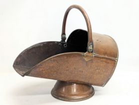 A Victorian copper coal scuttle. 31x53x47cm