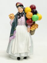 A Royal Doulton ‘Biddy Pennyfarthing’ figurine. HN1843. 21.5cm.