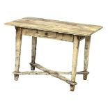 A late 19th century continental painted pine farmhouse kitchen table with drawer. Circa 1890.