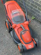 A Flymo electric lawnmower.
