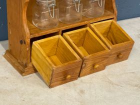 A pine wall hanging spice rack with glass jars. 29x11x39cm