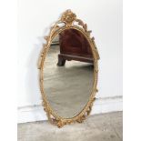 A brass framed mirror. 49cm