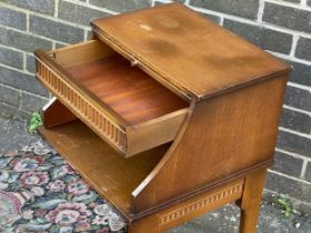 A vintage Chippy Heath telephone table with original pencil.