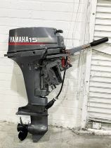 A large Yamaha 15 outboard boat engine. 103cm