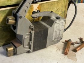 A heavy duty spot welder in box.