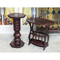 An ornate plant stand with a mahogany magazine rack