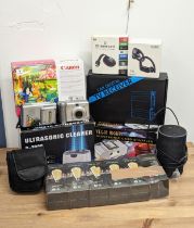 A sundry lot including a canon camera, Google Chromecast, Tozo earphones, Ultrasonic Cleaner D-2000,