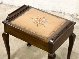 An early 20th century piano stool with tapestry seat. 54x39x55cm