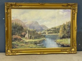 A large ornate gilt framed print. 90x64.5cm