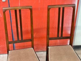 A pair of Edwardian inlaid mahogany side chairs.