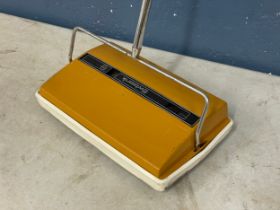 A Mid Century carpet sweeper by Ewbank.